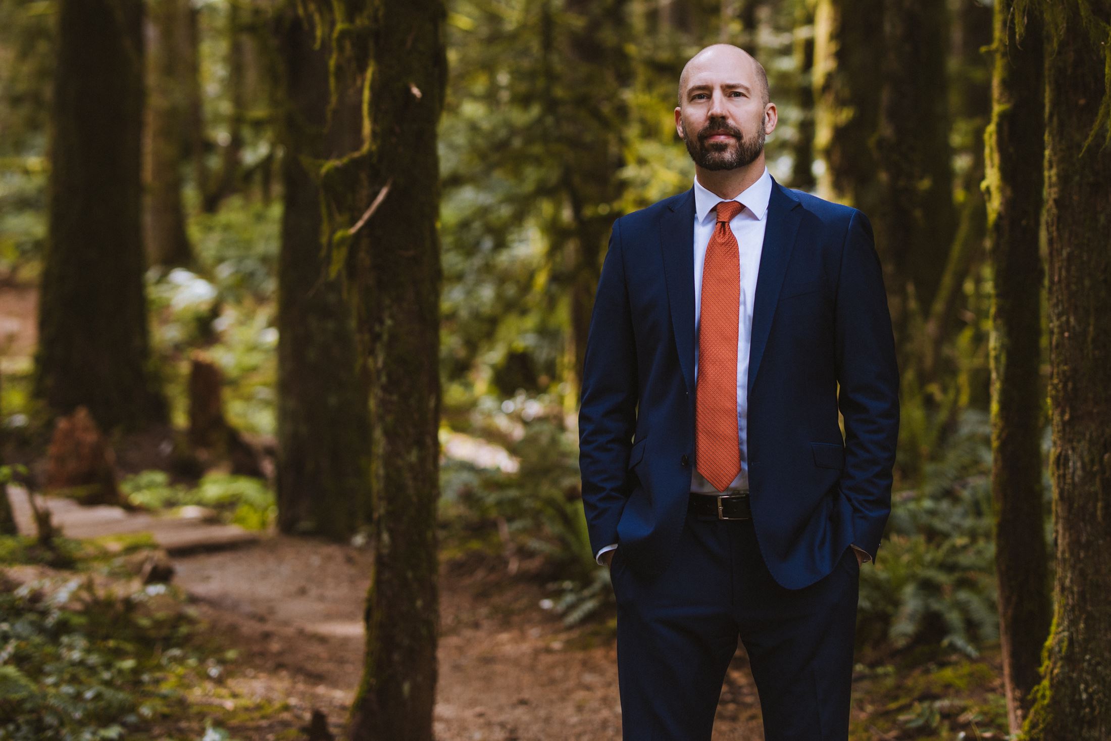 Shawn Gabel | Courtenay Real Estate Lawyer standing on a forested trail.